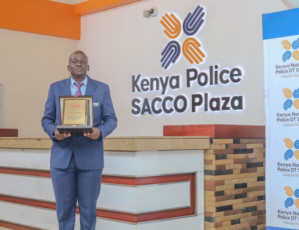 Kenya National Police DT SACCO CEO Mr. Solomon Atsiaya poses at the SACCO headquarters in Nairobi with the Award. PHOTO/COURTESY